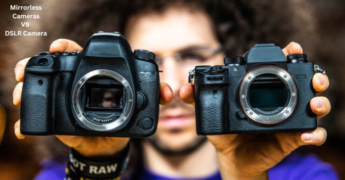 A person holding a DSLR camera in one hand and a mirrorless camera in the other, comparing their designs.